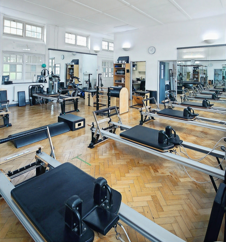 Reformer Pilates studio at The Sogunro Practice, London Colney, St Albans — full STOTT apparatus including Reformers, Cadillac, Wunda Chair and Step Barrel. Clinical Reformer Pilates and Applied Pilates serving St Albans, Harpenden, Radlett and Hatfield.